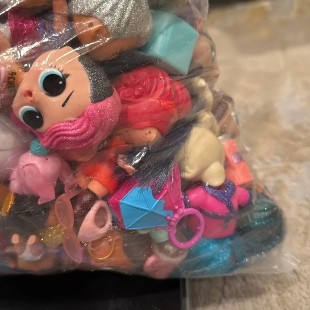 Almost 5lb of Lol dolls , dolls accessories , clothes and some furniture big lot